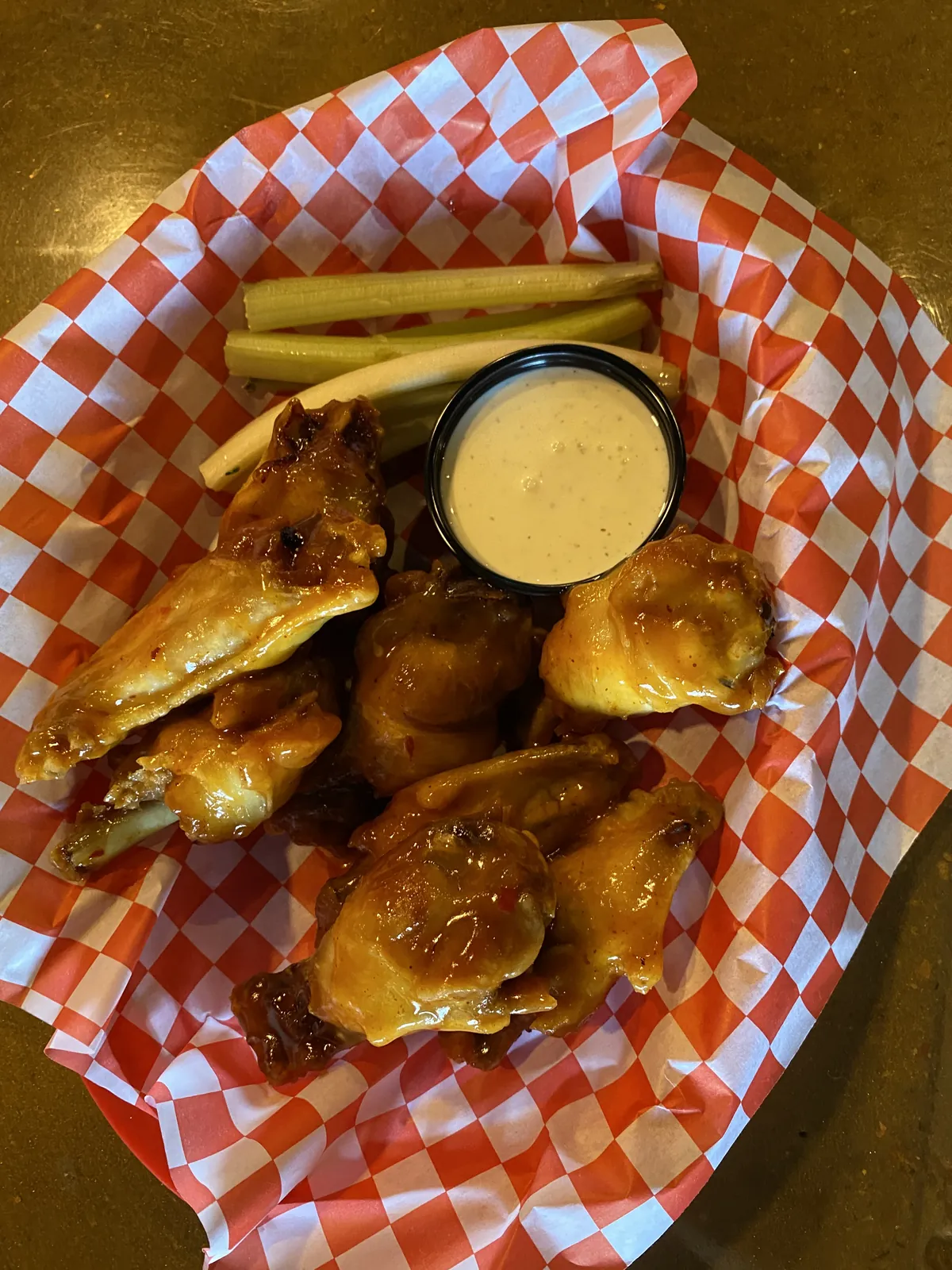 A basket of wings with dipping sauce at Nirvana DTX.