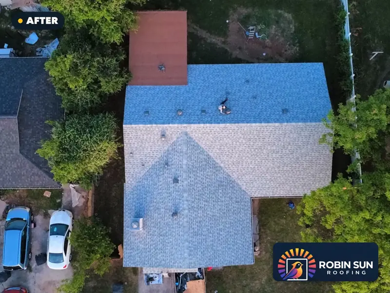 Drone view straight down on the same house with a new light-gray roof.